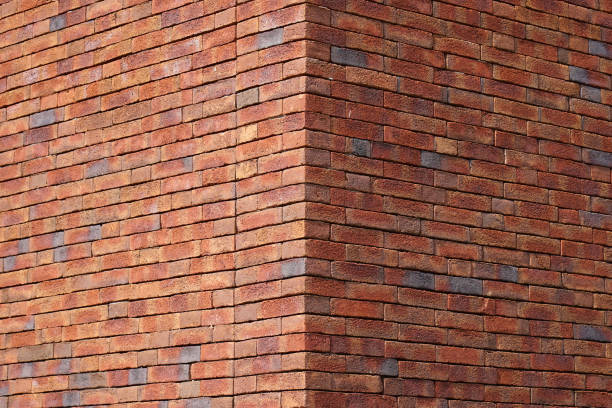 red brick wall hintergrund  - corner stone wall brick stock-fotos und bilder