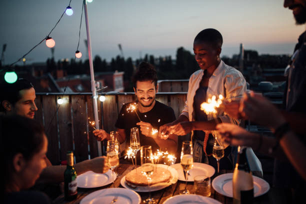istock Multi-ethnic friends enjoying rooftop party 1045994272