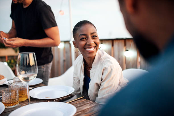 istock Friends chatting at rooftop party 1045996592