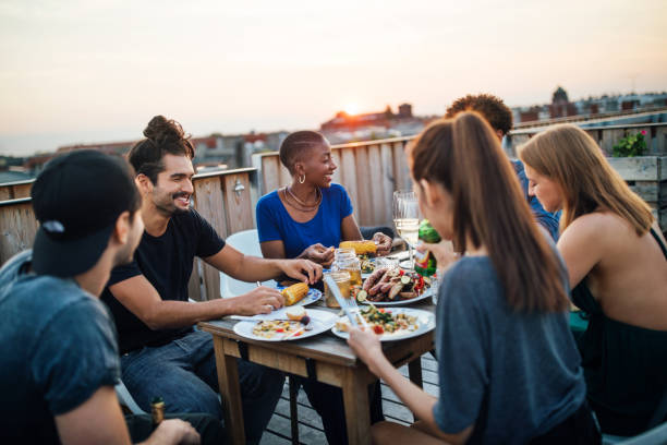Friends having food at rooftop party