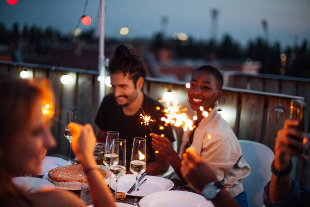 istock Multi-ethnic group of friends enjoying at rooftop party 1045997754