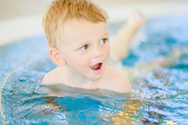 istock Portrait of smiling cute boy having fun, close-up 1046009802