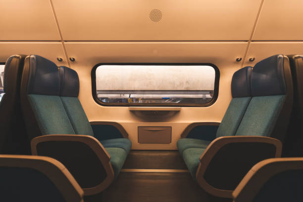 istock Empty interior of the train in Europe train carriage with blue seats 1046012546