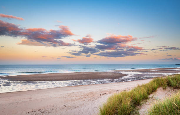 istock Druridge Bay Sandy Beach near sunset 1046013192
