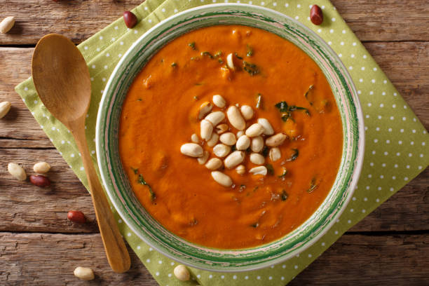 istock Vegetarian West African Peanut Soup close-up in a plate. horizontal top view 1046016432