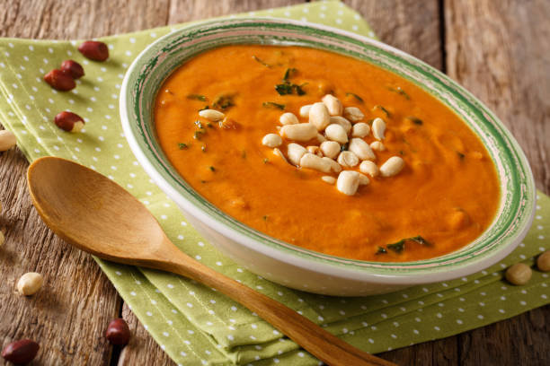 istock Freshly prepared peanut soup with greens close-up on a plate. horizontal 1046016660