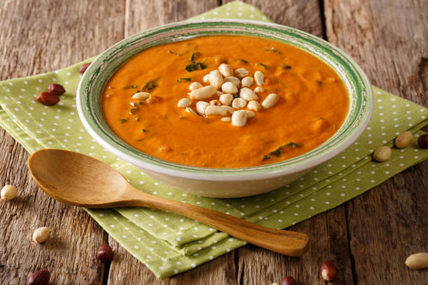 istock Dietary peanut soup with greens close-up on a plate. horizontal 1046016790