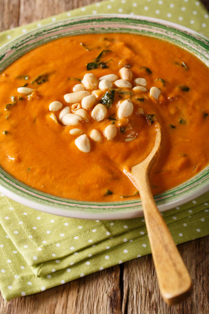 istock Vegetarian West African Peanut Soup close-up in a plate. Vertical 1046016878