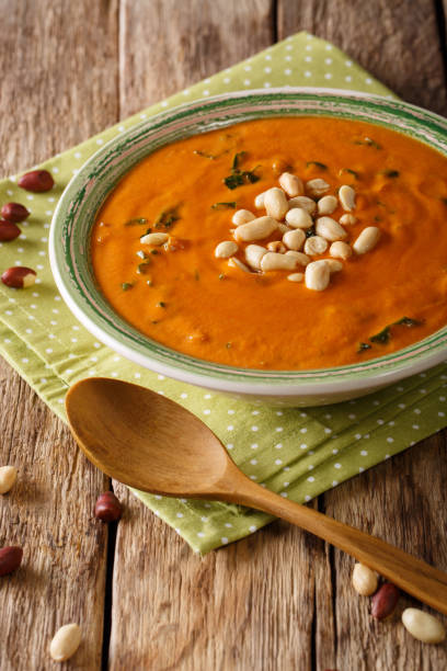 istock West African peanut soup with kale closeup on a table. vertical 1046016990