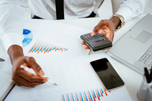 Close-up of a hands of African businessman working in the office.