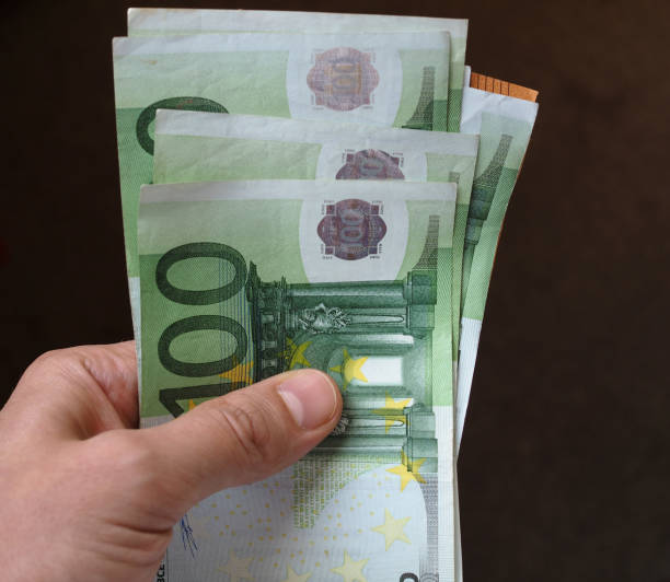 istock Hand with Euro notes, European Union 1046026788