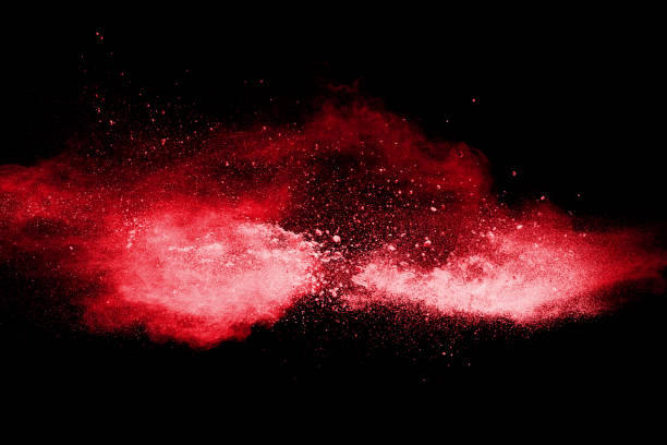 istock Red color powder explosion on black background. 1046030624