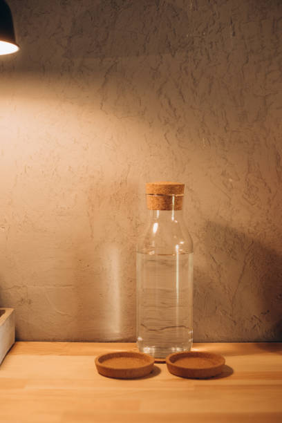 istock Glass bottle with water on the shelf 1046030806