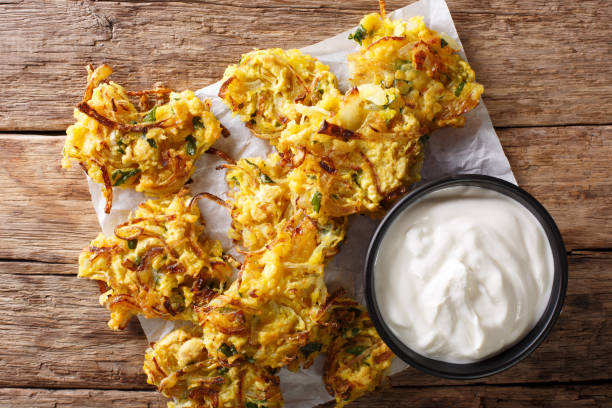istock Indian food: crispy fried onion Bhajis close-up. Horizontal top view 1046030860