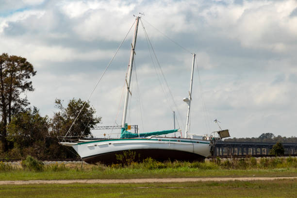 sailboat stranded by hurricane florence in new bern, nc - drifted imagens e fotografias de stock