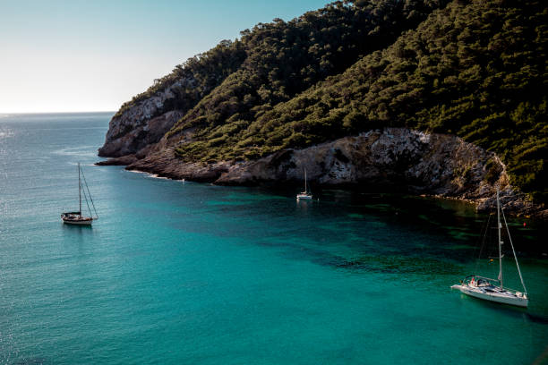 istock Sailing ships in the bay of Cala Llonga 1046040006