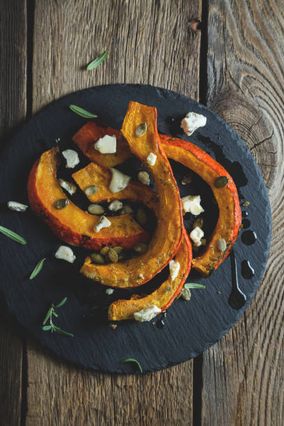 istock Warm Salad with Baked Pumpkin, Brussels Sprouts and Cranberries 1046040304