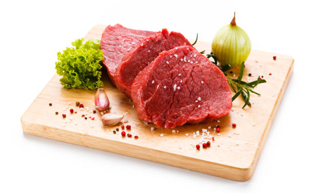 istock Raw beef on cutting board and vegetables 1046049960