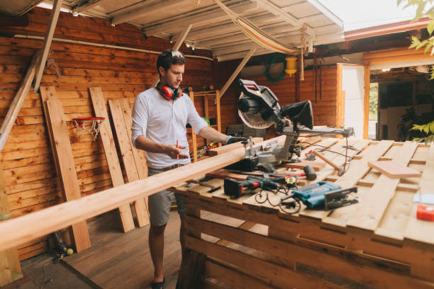 istock Young man working on a DIY woodworking project 1046050136