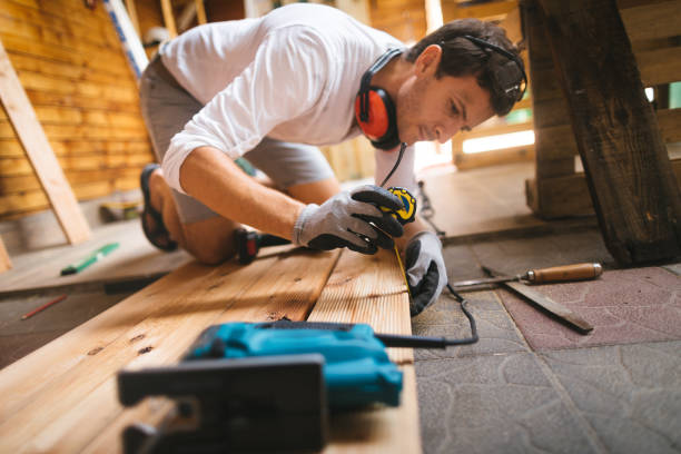 istock Young man working on a DIY wooden deck 1046050504