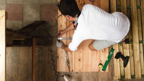 istock Young man working on a DIY wooden deck 1046050756
