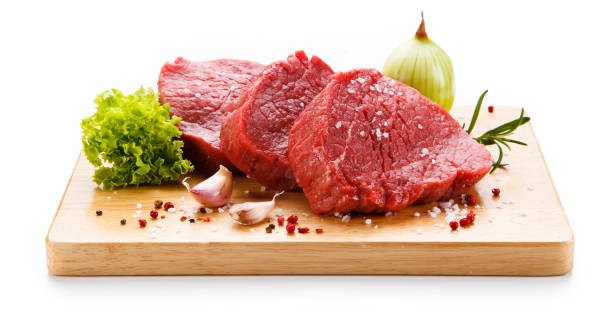 istock Raw beef on cutting board and vegetables 1046052932