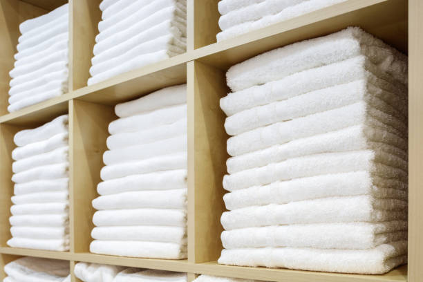 istock White Towels Folded and Stacked on a Shelf 1046054714