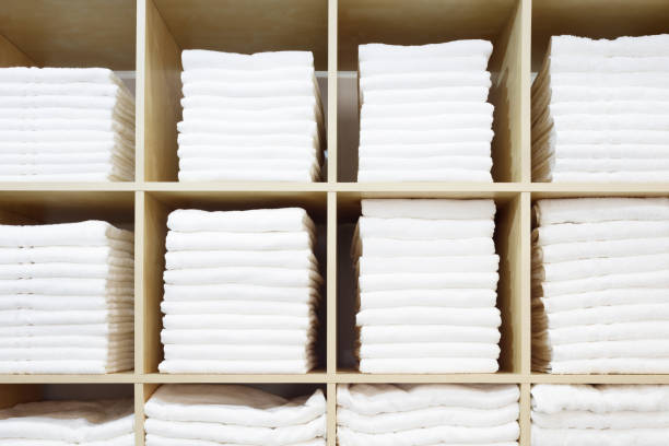 istock White Towels Folded and Stacked on a Shelf 1046055888