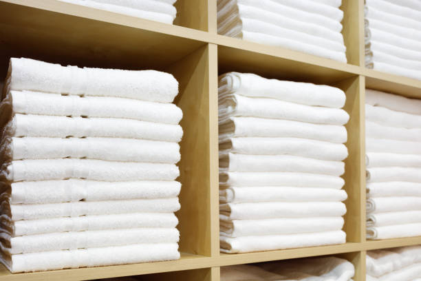 istock White Towels Folded and Stacked on a Shelf 1046056082