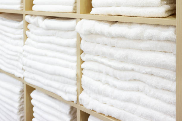 istock White Towels Folded and Stacked on a Shelf 1046056096