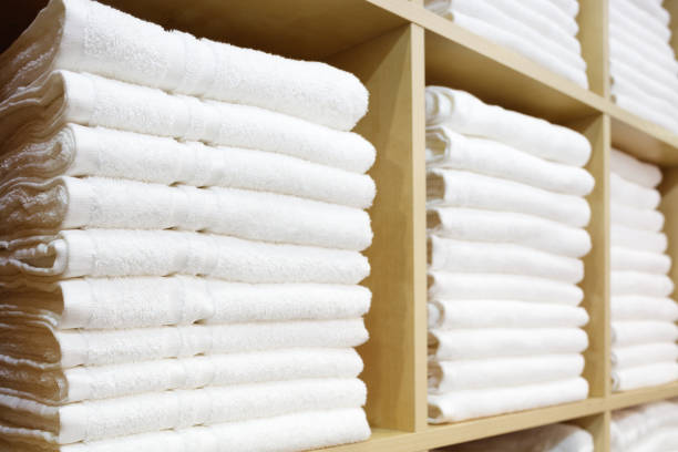 istock White Towels Folded and Stacked on a Shelf 1046056116