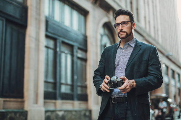 istock Cute gentleman taking pictures 1046062428