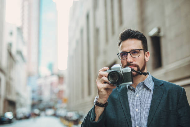 istock Gentleman taking pictures 1046062472