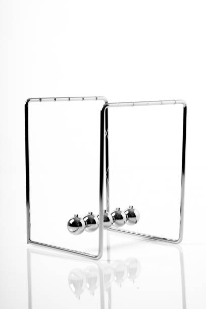 istock Newtons Cradle balancing balls, business concept in studio 1046071394