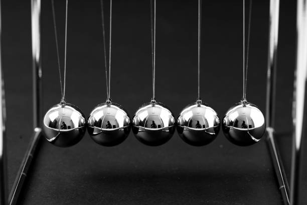 istock Newtons Cradle balancing balls, business concept in studio 1046071424