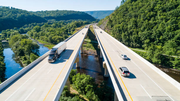 The aerial scenic view of the elevated highway on the high bridge over the Lehigh River at the Pennsylvania Turnpike. Lehigh Valley, Poconos region, Pennsylvania, USA.