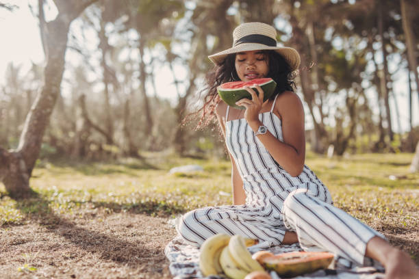 istock Girl eating a watermelon 1046075682