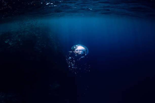 istock Underwater dark texture in ocean. Bubble in sea. 1046077866