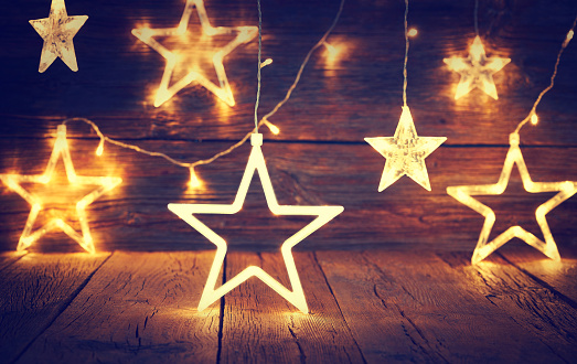 Christmas light stars vintage rustic wooden background decoration