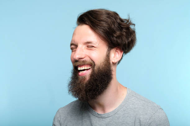 istock facial expression happy joyful smiling hipster man 1046086900