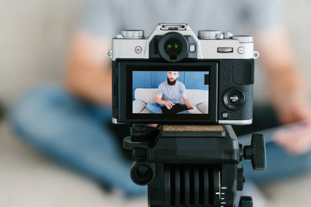 istock blogger shoot video man camera screen equipment 1046086958
