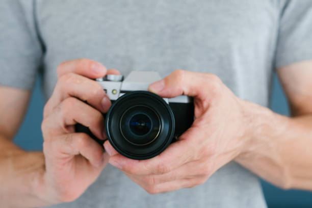 istock technology photo video man holding camera blogging 1046086964
