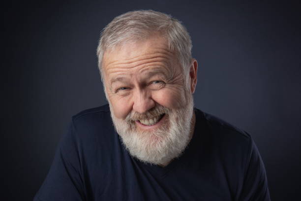 istock Old man portrait smiling fake 1046087422