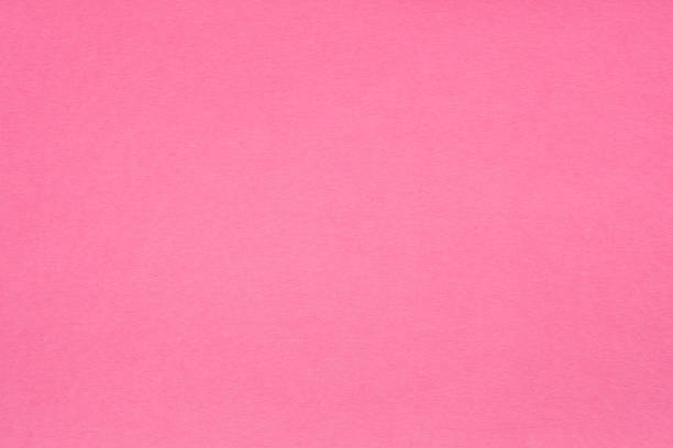 istock pink paper texture background fibers grain empty 1046088210