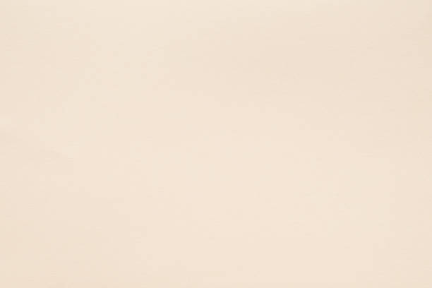 istock beige paper texture background fibers grain empty 1046088212
