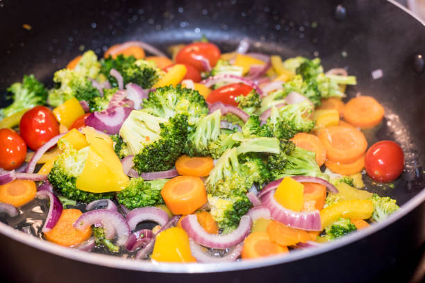 istock Steaming mixed vegetables in the wok, asian style cooking 1046091434