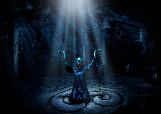 istock Witch in night forest with ray of light ver 1046095516
