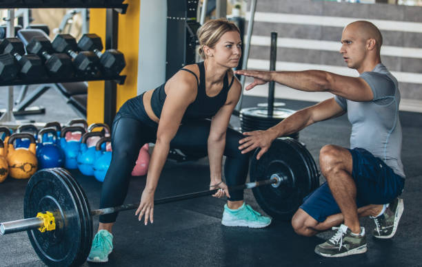 istock Fitness trainer working with girl 1046096106