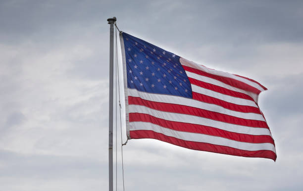 istock American flag waving 1046110870