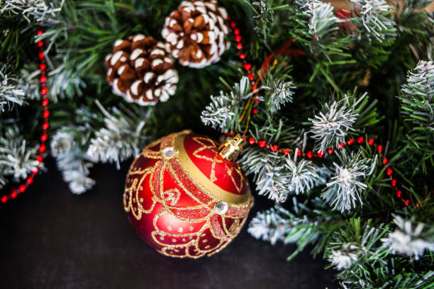 istock Red Christmas decoration bauble with ribbon bow isolated on white background 1046112448